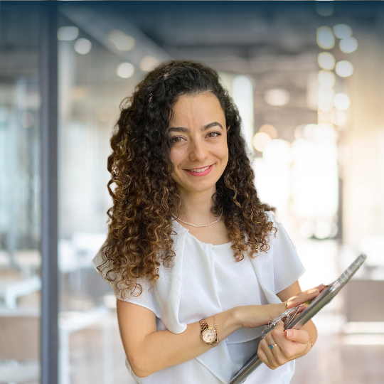 Happy Business Woman Holding a computer Ana, Anaïs Bouvier Gonzalez CoCreateSuccess